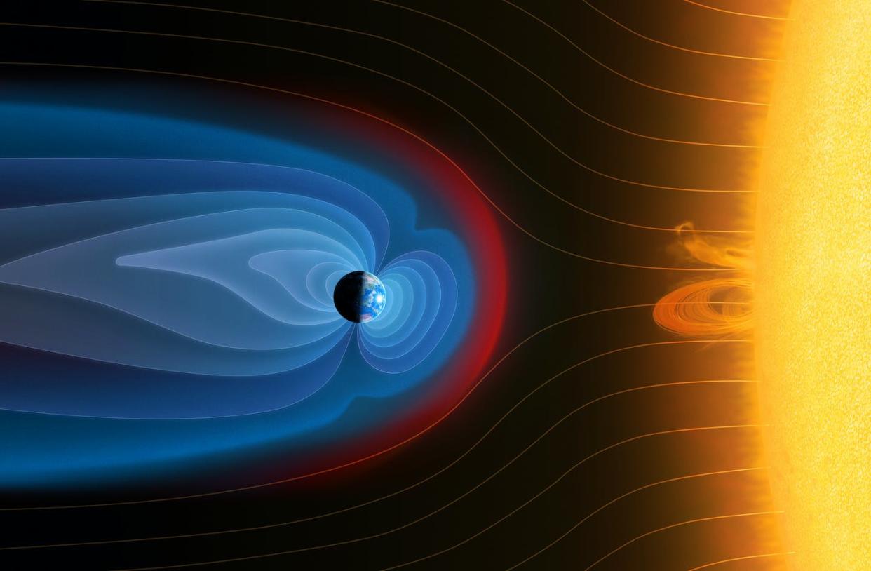 The Earth's magnetic field deflects particles emitted by the Sun. <a href="https://www.gettyimages.com/detail/illustration/earths-magnetosphere-illustration-royalty-free-illustration/1316974949?phrase=earth+magnetosphere&adppopup=true" rel="nofollow noopener" target="_blank" data-ylk="slk:Mark Garlick/Science Photo Library via Getty Images;elm:context_link;itc:0;sec:content-canvas" class="link ">Mark Garlick/Science Photo Library via Getty Images</a>