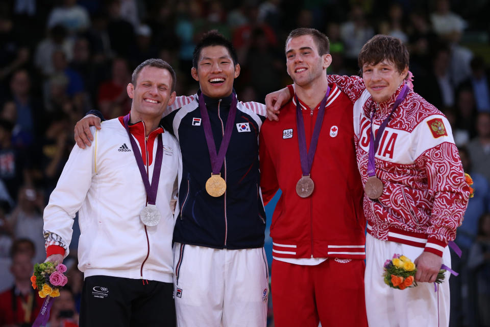LONDON, ENGLAND - JULY 31: (L-R) Silver medalist Ole Bischof of Germany, Gold medalist Jae-Bum Kim of Korea, Bronze medalist B Antoine Valois-Fortier of Canada, and Bronze medalist A Ivan Nifontov of Russia Bronze medalist A Ivan Nifontov of Russia in the Men's -81 kg Judo on Day 4 of the London 2012 Olympic Games at ExCeL on July 31, 2012 in London, England. (Photo by Quinn Rooney/Getty Images)
