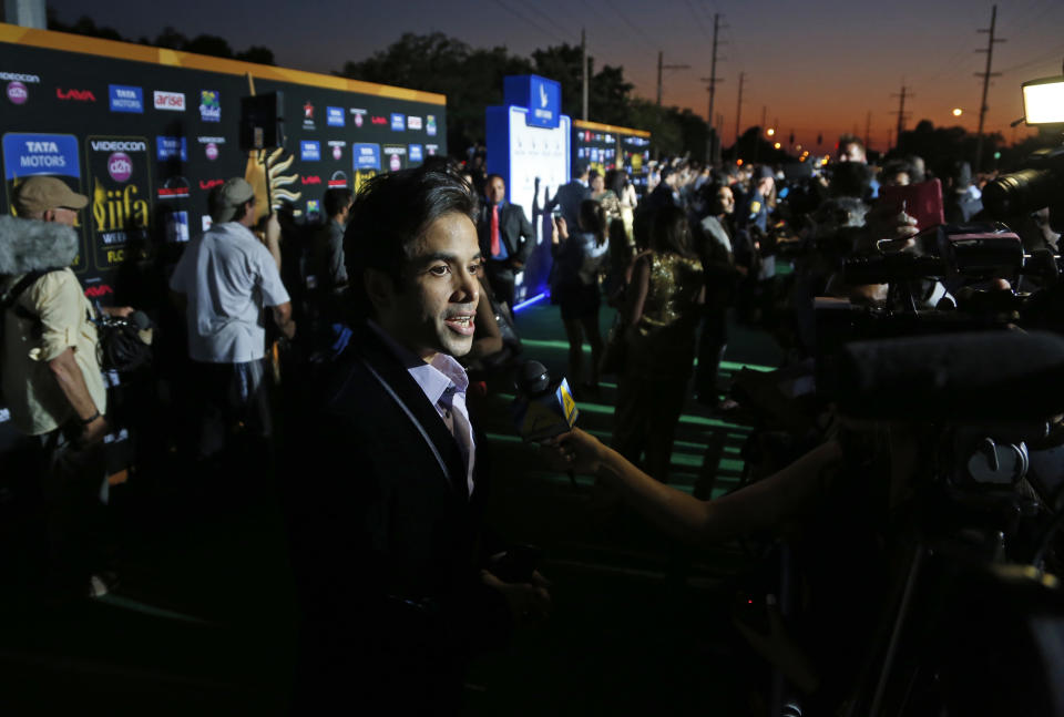 Indian film star Tusshar Kapoor walks the green carpet as he arrives for the 15th annual International Indian Film Awards on Saturday, April 26, 2014, in Tampa, Fla. (AP Photo/Brian Blanco)