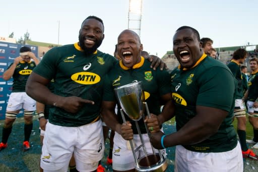 The Springbok front row of Tendai Mtawarira (L), Bongi Mbonambi and Trevor Nyakane celebrate winning the Rugby Championship in Argentina