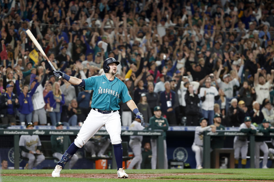 SEATTLE, WASHINGTON - SEPTEMBER 30: Cal Raleigh #29 of the Seattle Mariners celebrates his walk-off home run during the ninth inning against the Oakland Athletics at T-Mobile Park on September 30, 2022 in Seattle, Washington. With the win, the Seattle Mariners have clinched a postseason appearance for the first time  in 21 years, the longest playoff drought in North American professional sports. (Photo by Steph Chambers/Getty Images)