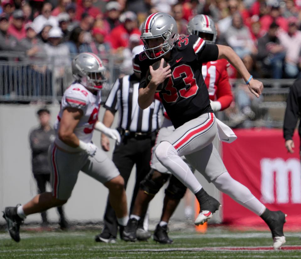 Ohio State quarterback Devin Brown runs for yardage in Saturday's spring game.