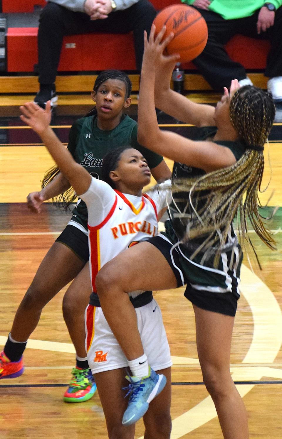 Saniyah Hall goes up for two of her 28 points against Purcell Marian, shooting over Dee Alexander.