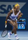 Serena Williams of the U.S. reacts as she wins a point against Maria Sharapova of Russia during their women's singles semi-finals match at the Brisbane International tennis tournament in Brisbane, January 3, 2014. REUTERS/Jason Reed