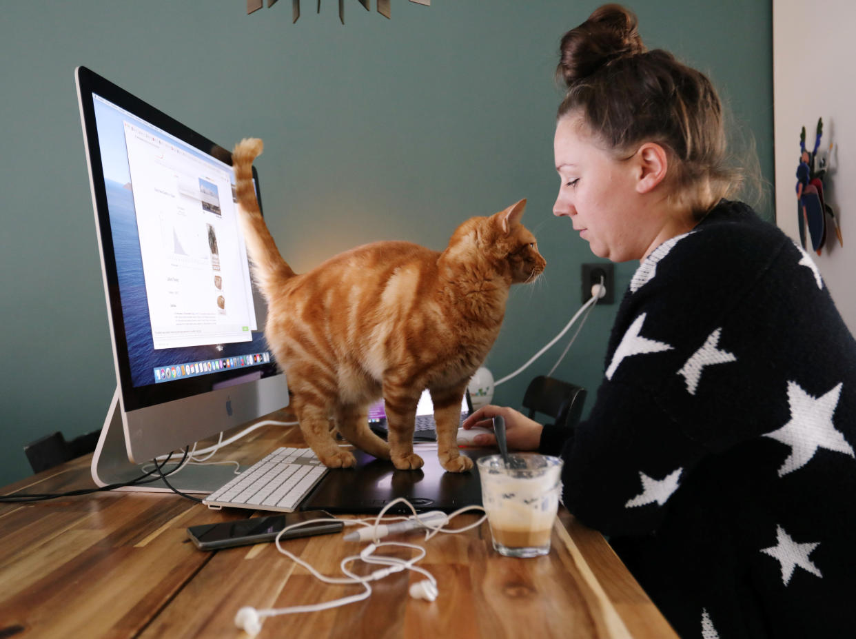 A woman works in a house while workers are forced to work from home and demand payback for extra home office costs during the coronavirus disease (COVID-19) outbreak in Sassenheim, Netherlands October 2, 2020. Picture taken October 2, 2020. REUTERS/Eva Plevier