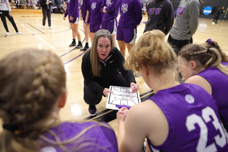 New York University women's basketball's head coach, Meg Barber, addresses the team at a recent game.