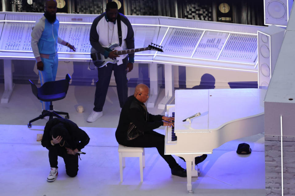Eminem takes a knee as he performs with Dr. Dre and others during the halftime show of Super Bowl LVI.<span class="copyright">Gregory Shamus/Getty Images</span>