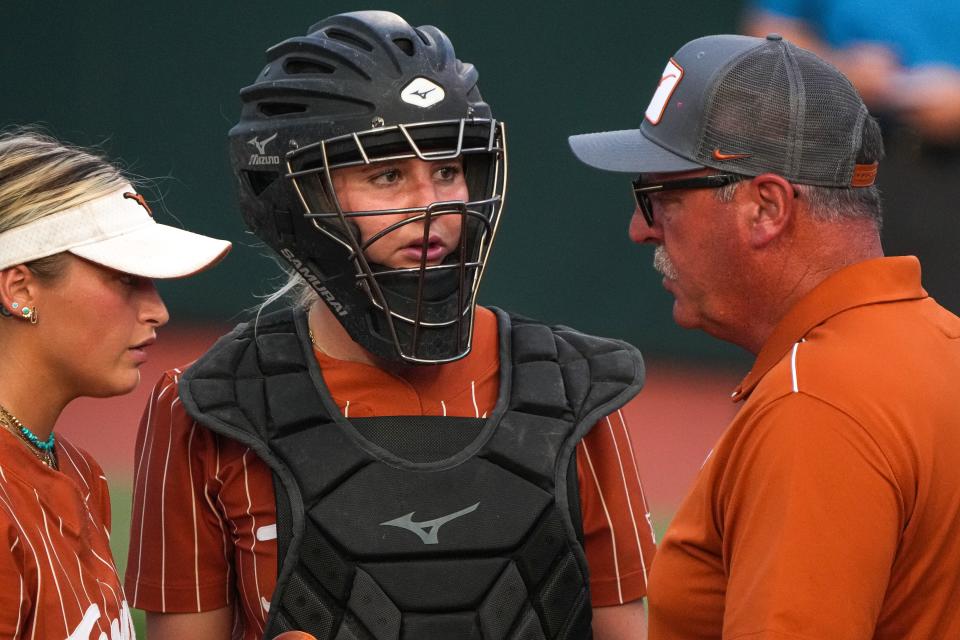 Texas catcher Reese Atwood, with head coach Mike White, said of the top-five matchup: “I think both teams are equally as talented. So it's going to come down to who can come up in the big moments and who can make the big plays.