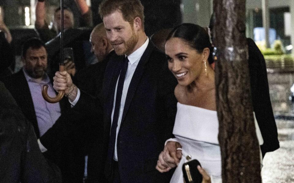 The pair held hands as they arrived at the Hilton - Getty