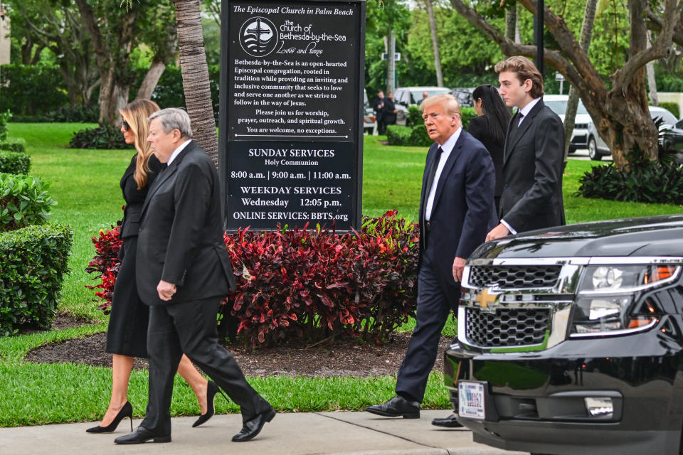 Former US President Donald Trump (2R), his wife Melania Trump (L) their son Barron Trump (R) and father-in-law Viktor Knavs (2L), attend a funeral for Amalija Knavs, the former first lady's mother, at the Church of Bethesda-by-the-Sea, in Palm Beach, Florida, on January 18, 2024. Former first lady Melania Trump's mother Amalija Knavs, 78, died January 9, 2024 in Miami following an undisclosed illness. (Photo by GIORGIO VIERA / AFP) (Photo by GIORGIO VIERA/AFP via Getty Images)