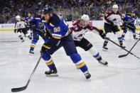 Dec 14, 2018; St. Louis, MO, USA; St. Louis Blues center Ryan O'Reilly (90) handles the puck against Colorado Avalanche center Nathan MacKinnon (29) during the third periodat Enterprise Center. Mandatory Credit: Jeff Curry-USA TODAY Sports