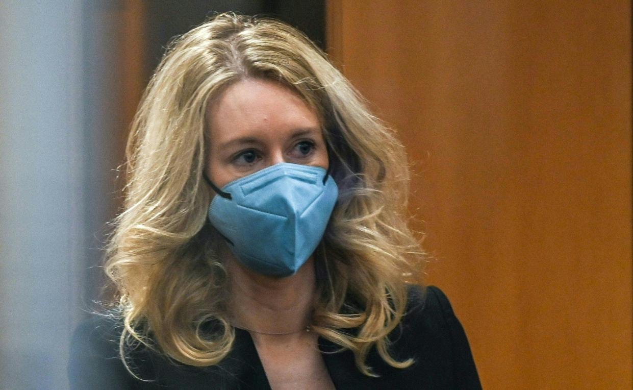 Former Theranos founder and CEO Elizabeth Holmes goes through security after arriving for court at the Robert F. Peckham Federal Building on November 22, 2021 in San Jose, California. (Photo by Amy Osborne / AFP) 
