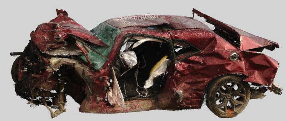 A 3D laser scan shows damage to a Dodge Challenger involved in a Las Vegas collision that killed nine people in November 2023. The driver was going 103 mph when he ran a red light, according to the NTSB. The view is from the driver’s side; the door was removed to extricate the driver.