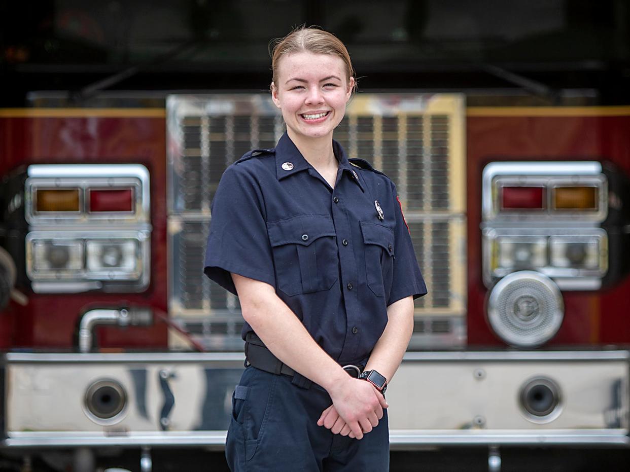 Haley Stevenson of Galesburg poses for a photo on her first day on the job as a Galesburg firefighter on Monday, May 2, 2022, at the Central fire station. Stevenson was sworn in earlier Monday as the first female firefighter in department history.