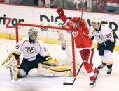 DETROIT, MI - APRIL 15: Pavel Datsyuk #13 of the Detroit Red Wings celebrates a second period goal in front of Pekka Rinne #35 and Roman Josi #59 of the Nashville Predators during Game Three of the Western Conference Quarterfinals during the 2012 NHL Stanley Cup Playoffs at Joe Louis Arena on April 15, 2012 in Detroit, Michigan. (Photo by Gregory Shamus/Getty Images)