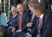 Russian President Vladimir Putin, Formula One supremo Bernie Ecclestone and Honorary IOC member Jean-Claude Killy watch the race during the Formula One Russian Grand Prix in Sochi, Russia, May 1, 2016. Alexei Druzhinin/Sputnik/Kremlin via Reuters