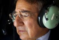 US Secretary of Defense Leon Panetta looks out the window of a Blackhawk helicopter as he flys over Baghdad. American forces are pursuing Iran-backed insurgents in Iraq, Panetta said in Baghdad on Monday as US deaths spike nearly a year after US troops formally ended combat operations