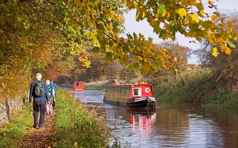 walkers on the Union Canal - Credit: Phil Seale/Alamy