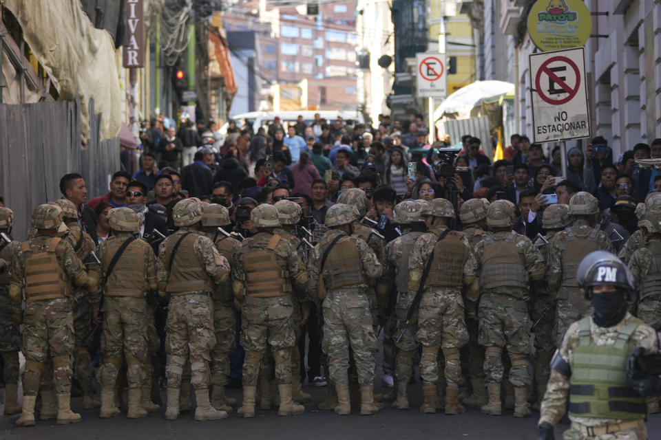 Military police block entry to Plaza Murillo in La Paz, Bolivia, Wednesday, June 26, 2024. Armored vehicles rammed into the doors of government palace located in Plaza Murillo, on Wednesday, as President Luis Arce said the country faced an attempted coup. (AP Photo/Juan Karita)