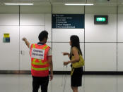 SBS Transit staff from various divisions were activated as "goodwill ambassadors", placed around the station to help give commuters directions to bridging bus services at ground level. (Yahoo! photo/Jeanette Tan)