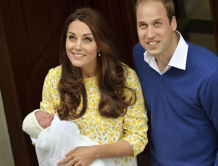 Britain's Prince William and his wife Catherine, Duchess of Cambridge, appear with their baby daughter outside the Lindo Wing of St Mary's Hospital, in London, Britain May 2, 2015. REUTERS/John Stillwell/pool