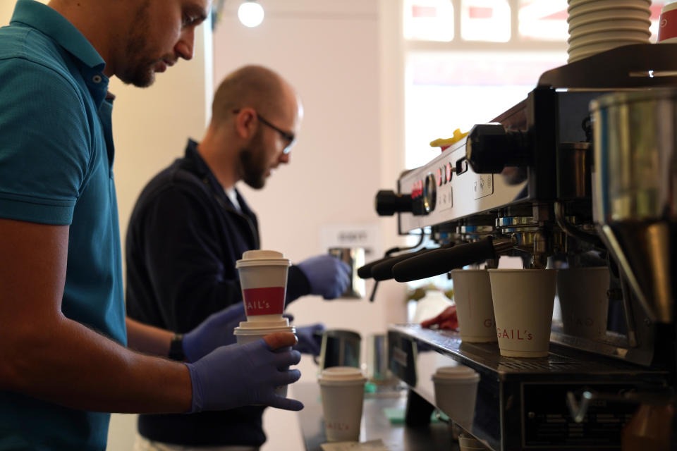 A barista makes a coffee at Gail's bakery-and-cafe in Salusbury Road, Queen's Park 