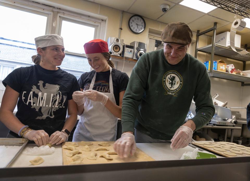 Joe Leone works alongside volunteers making pierogi. All sales will go to helping the people of Ukraine.