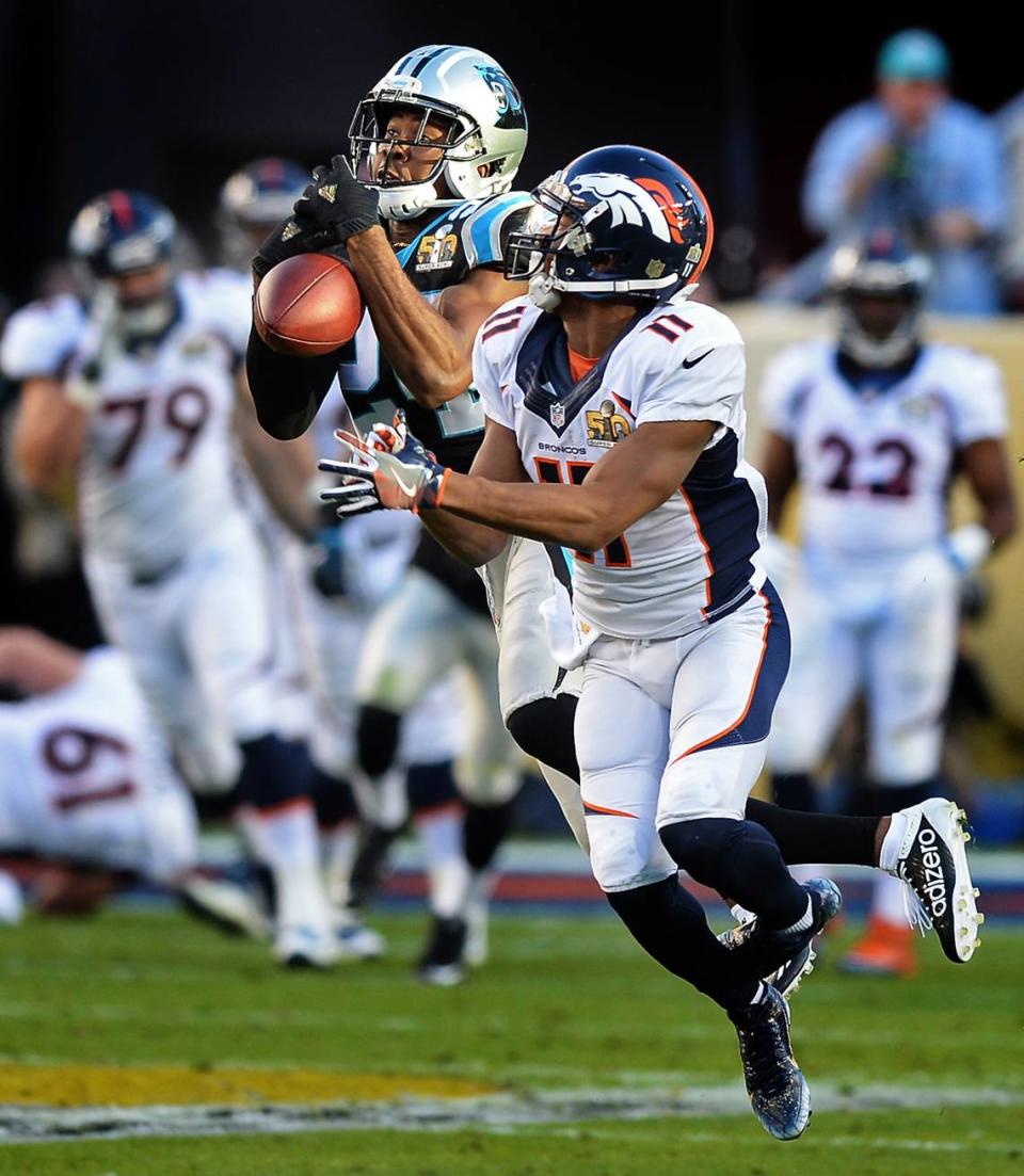 Carolina Panthers cornerback Josh Norman, left, attempts to intercept a pass by Denver Broncos quarterback Peyton Manning intended for wide receiver Jordan Norwood, right, during the second quarter of Super Bowl 50 at Levi’s Stadium in Santa Clara, Calif., on Feb. 7, 2016. Norman dropped the pass, and the Denver Broncos defeated the Panthers 24-10.
