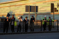 <p>People look on as firefighters deal with a serious fire in a tower block at Latimer Road in West London, Britain June 14, 2017. (Toby Melville/Reuters) </p>