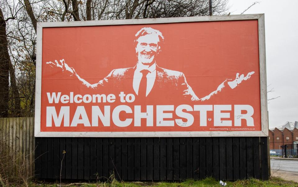 A billboard outside Manchester United's Old Trafford stadium shows Sir Jim Ratcliffe, a potential Manchester United shareholder