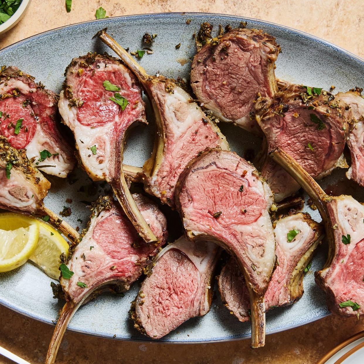 roasted rack of lamb served with lemon wedges