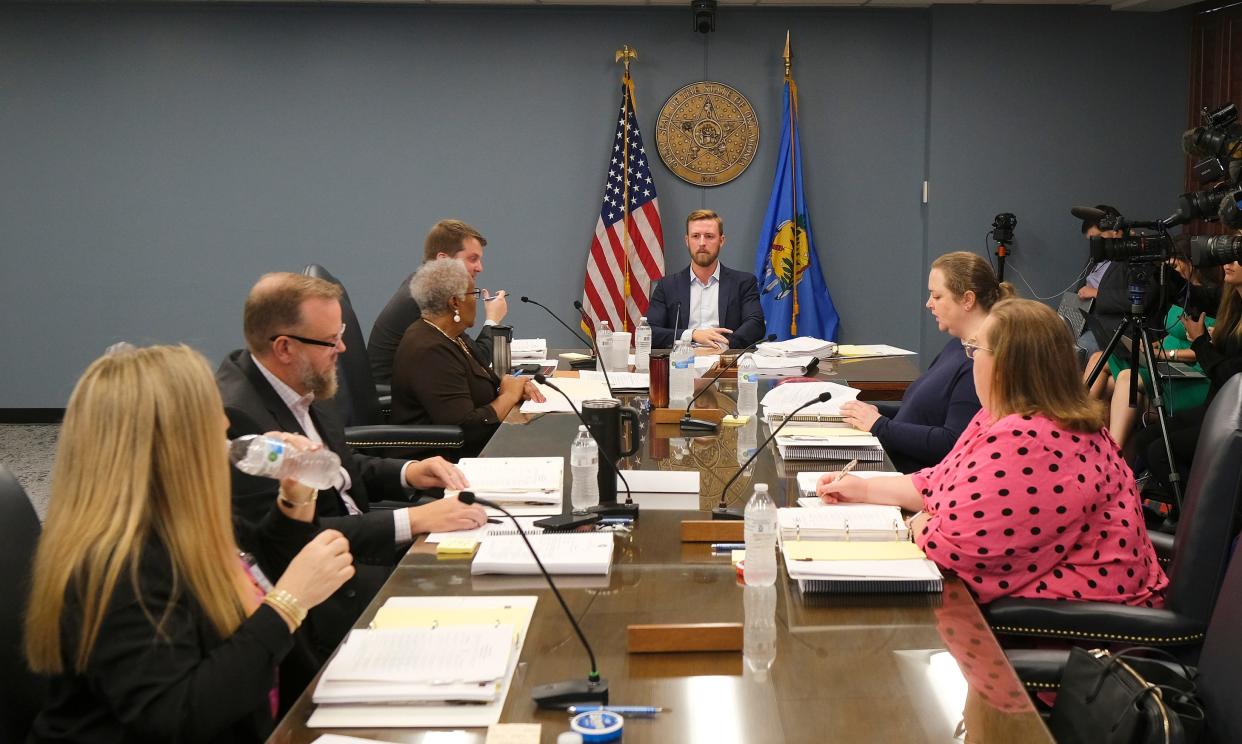 Ryan Walters, state schools superintendent, listens Thursday to discussion from the Oklahoma State Board of Education during its meeting.