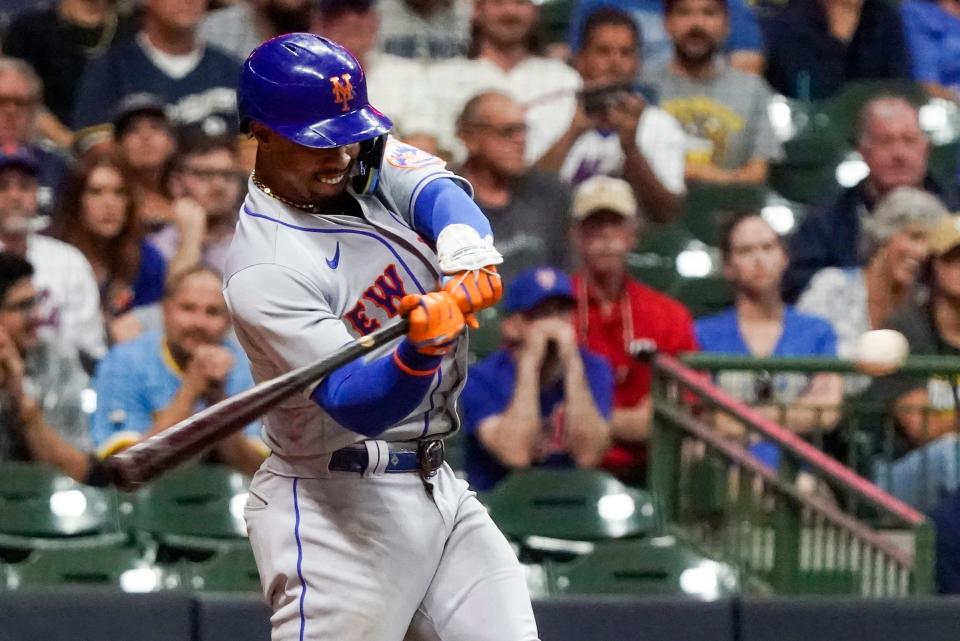 New York Mets' Francisco Lindor hits a grand slam during the seventh inning of a baseball game against the Milwaukee Brewers Tuesday, Sept. 20, 2022, in Milwaukee. (AP Photo/Morry Gash)