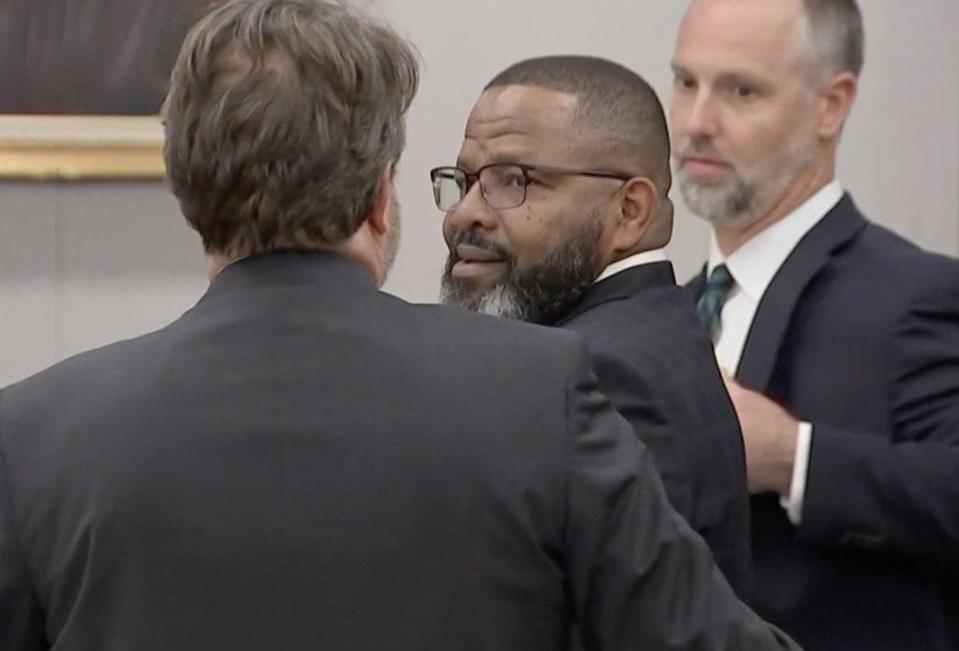 A relieved Darryl Daniels smiles before embracing his attorneys after the jury announced the former Clay County sheriff is not guilty on all counts in his trial in September.