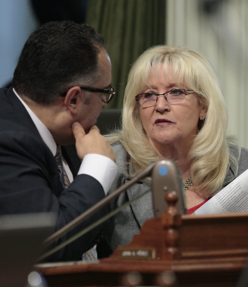 Assembly Speaker John Perez, D-Los Angeles, and Assembly Minority Leader Connie Conway, R-Tulare, confer as the Assembly debated one of the budget-related bills at the Capitol in Sacramento, Calif. Wednesday, June 27, 2012. Lawmakers rushed to wrap up work on nearly two dozen budget "trailer bills" to implement the main budget bill that was passed 12 days ago. (AP Photo/Rich Pedroncelli)