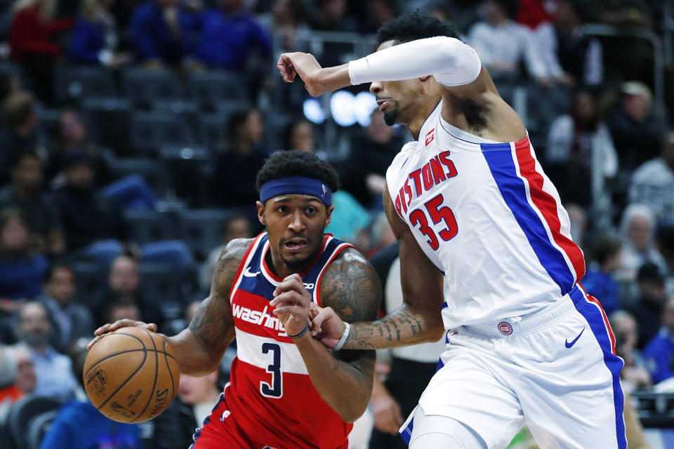 Washington Wizards guard Bradley Beal (3) drives on Detroit Pistons forward Christian Wood (35) in the second half of an NBA basketball game in Detroit, Monday, Dec. 16, 2019. (AP Photo/Paul Sancya)