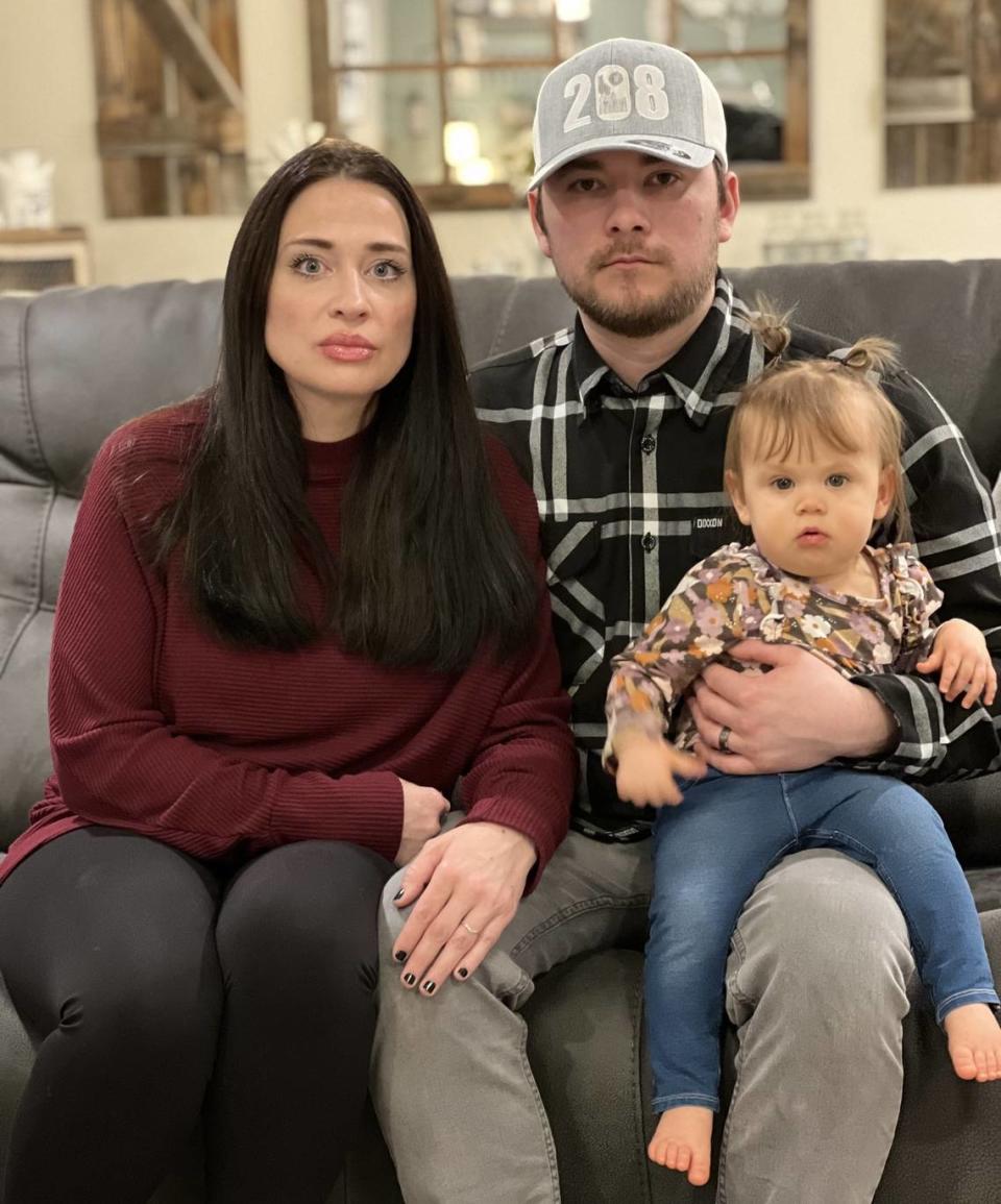 Aubrey Nobili, her husband Ryan, and their daughter, Vivi, in their Nampa home. The family still experiences the consequences of a tongue-tie procedure.