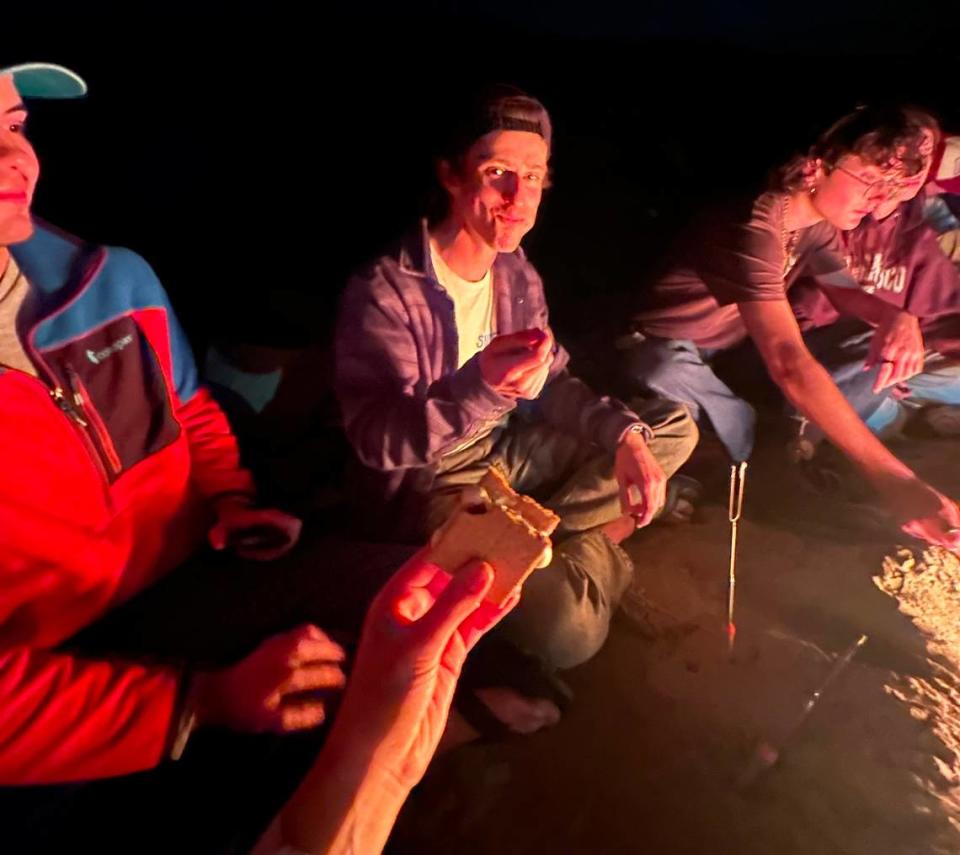 Kenneth Taylor enjoys a campfire with friends. Taylor, a third-year Cal Poly student, died while on a climbing trip at Salmon Creek waterfall in Big Sur on April 6, 2024.