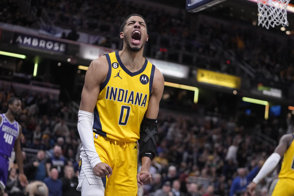 Indiana Pacers' Tyrese Haliburton reacts after a dunk during the second half of an NBA basketball game against the Sacramento Kings, Friday, Feb. 3, 2023, in Indianapolis. (AP Photo/Darron Cummings)