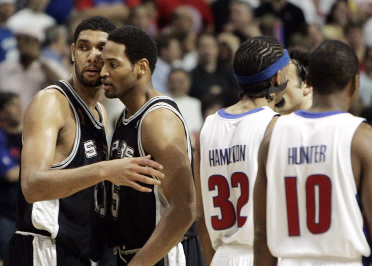 Tim Duncan and Robert Horry in friendlier times. (AP)