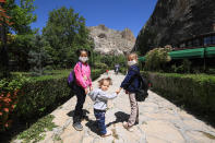 Kids play at the park in Tohma Canyon after children under 14 years across Turkey allowed to leave their homes, remaining within walking distance and wearing masks, on May 13 between 11 a.m. and 3 p.m. local time, in Malatya, Turkey on May 13, 2020. Turkey on Wednesday eased coronavirus (Covid-19) restrictions for young people under 14 years old. (Photo by Ayhan Iscen/Anadolu Agency via Getty Images)