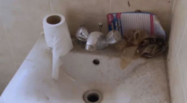 Footage shows containers on the floor of the bathroom and a dark powder covering the sink. Photo: Channel4