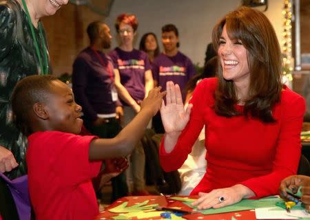 Britain's Catherine, Duchess of Cambridge takes part in group activities as she attends the Anna Freud Centre Family School Christmas Party at Anna Freud Centre, in London, December 15, 2015. REUTERS/Chris Jackson/Pool/Files