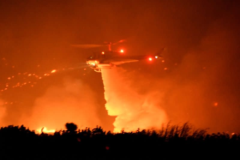 Wildfire in California burns through the night north of Los Angeles