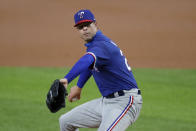 FILE - In this July 9, 2020, file photo, Texas Rangers pitcher Corey Kluber throws during an intrasquad game in Arlington, Texas. The New York Yankees reached a deal with Kluber worth $11 million for one year, a person familiar with the negotiations told The Associated Press. The person spoke on condition of anonymity Friday, Jan. 15, because the agreement is subject to a successful physical. (AP Photo/Tony Gutierrez, File)