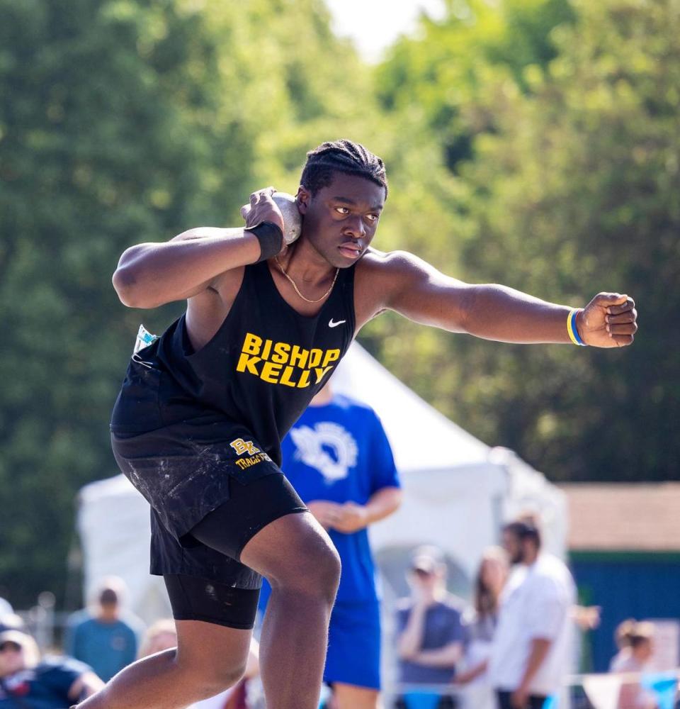 Rakeem Johnson of Bishop Kelly competes in the 4A boys shot put at the state track and field championships Saturday at Mountain View High School. Johnson took third place.