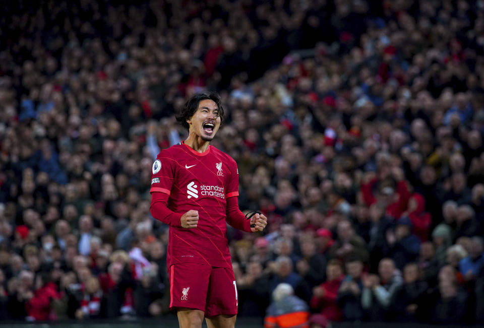 Liverpool's Takumi Minamino celebrates after scoring his side's fourth goal during the English Premier League soccer match between Liverpool and Arsenal at Anfield Stadium, Liverpool, England, Saturday, Nov. 20, 2021 (Peter Byrne/PA via AP)