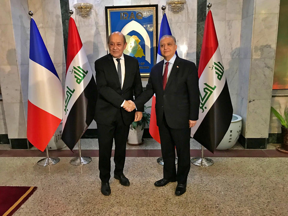 Iraqi Foreign Minister Mohamed Alhakim, right, shakes hands with visiting French Foreign Minister Jean-Yves Le Drian, in Baghdad, Iraq, Monday, Jan. 14, 2019. (AP Photo/Ali Abdul Hassan)