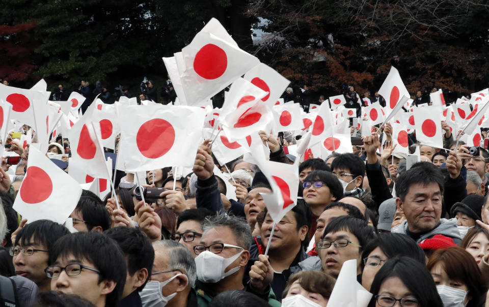 Well-wishers cheer as Japan's Emperor Akihito with his family members appear on the balcony of the Imperial Palace to mark the emperor's 85th birthday in Tokyo Sunday, Dec. 23, 2018. (AP Photo/Eugene Hoshiko)