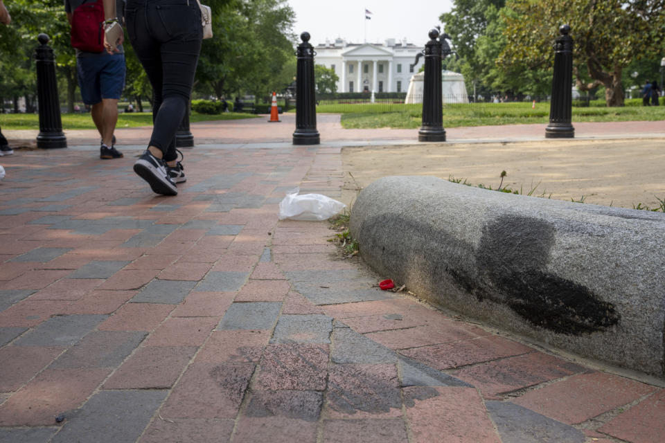 FILE - Tire marks remain on a curb in Lafayette Square park near the White House, May 23, 2023, in Washington. A Missouri man pleaded guilty Monday, May 13, 2024, to crashing a rented truck into White House barriers last year. Sai Varshith Kandula drove a large U-Haul truck onto a sidewalk, sending pedestrians running for safety, before ramming it into metal bollard barriers that prevent vehicles from entering Lafayette Square. (AP Photo/Alex Brandon, File)